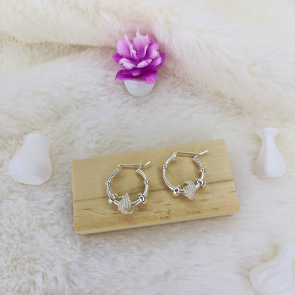 Aretes Aros con Nudo Texturizado en Plata